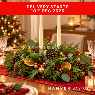 Christmas table centrepiece with Christmas flowers, foliages and decoratives