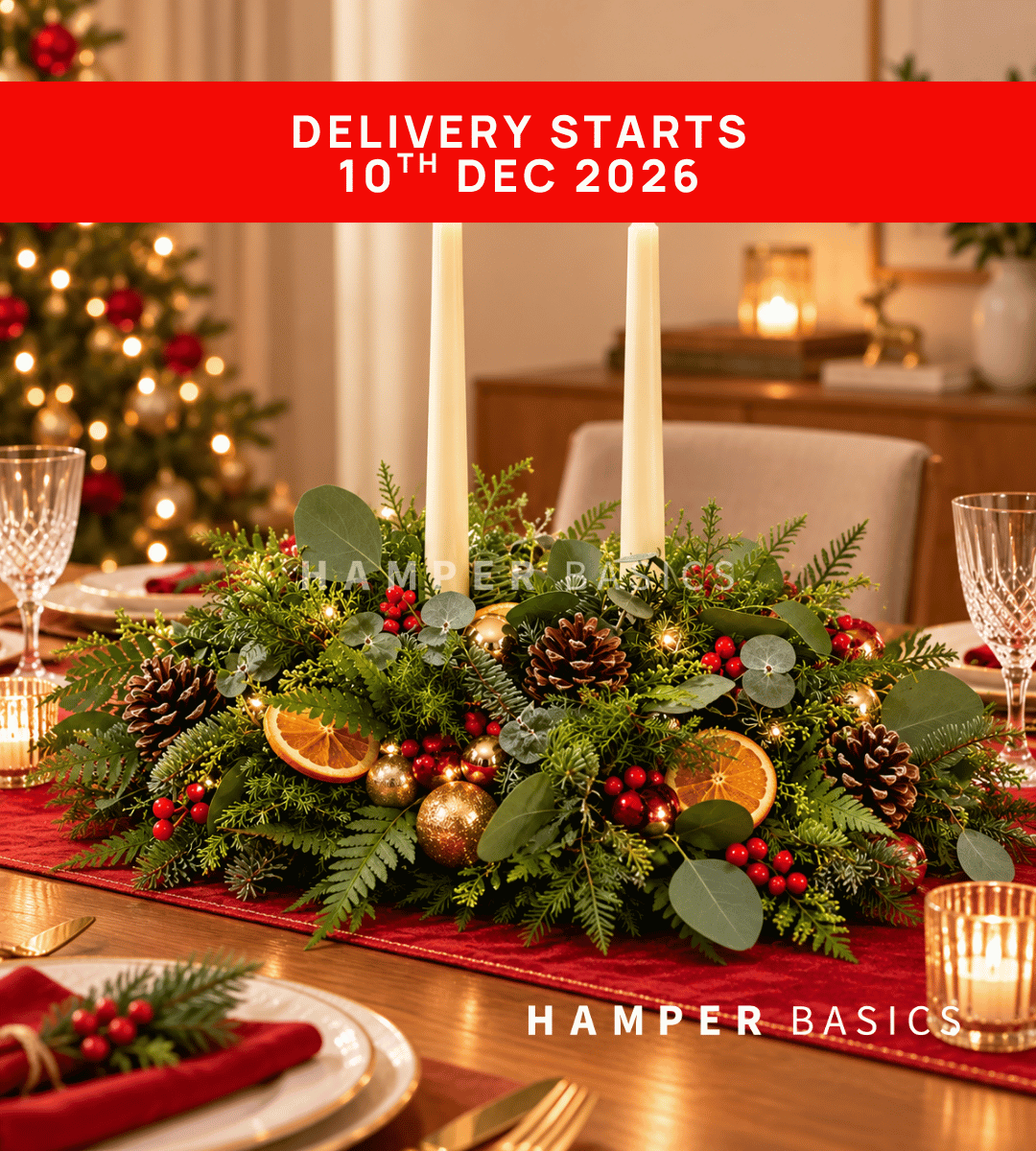 Christmas table centrepiece with Christmas flowers, foliages and decoratives