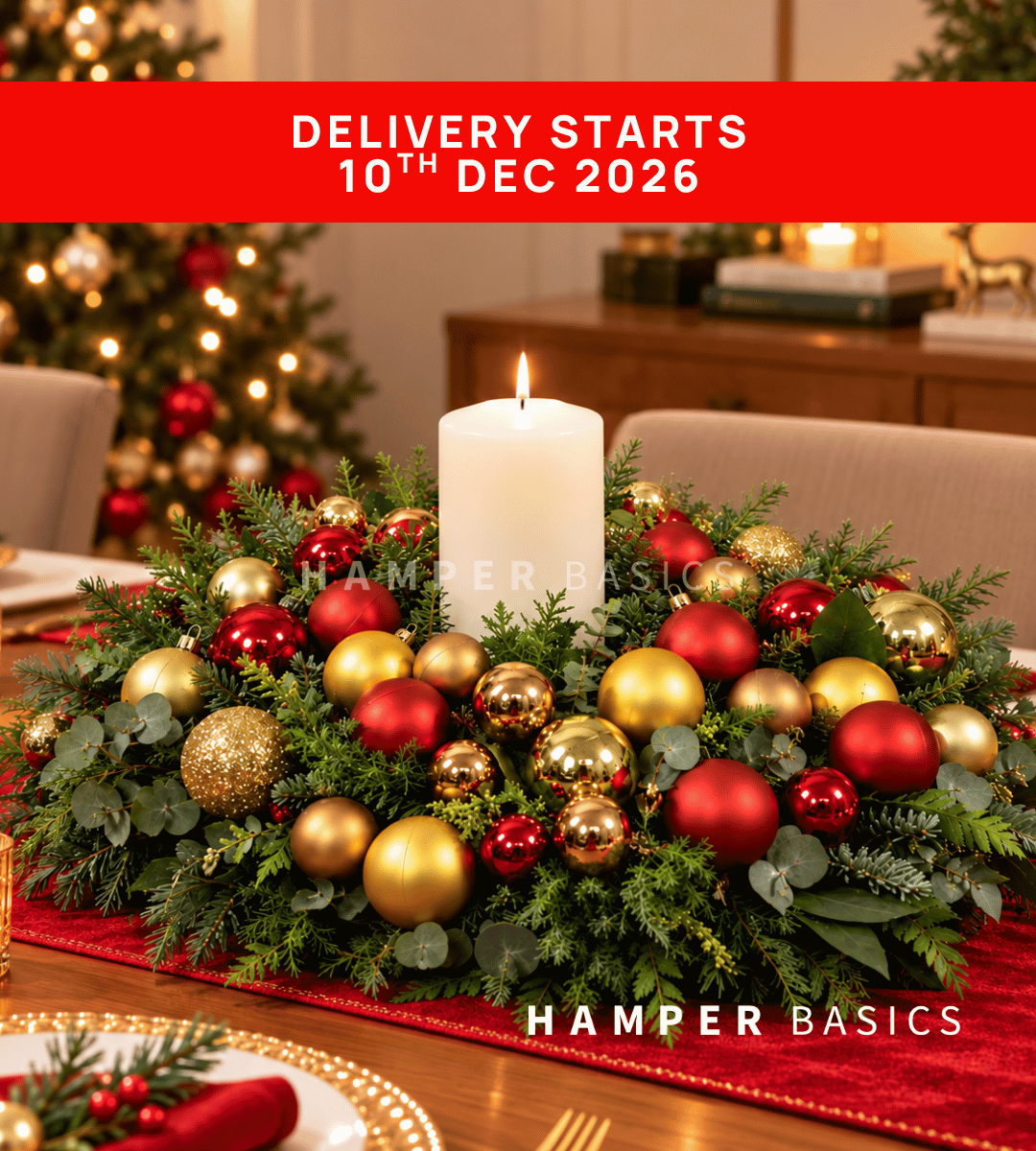 Christmas table centrepiece with Christmas ornaments and festive foliages