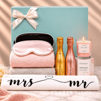 Newlywed gift with soft towels, his-and-hers satin sleep masks, scented candle, Bottega Gold and Rosé Gold sparkling wines and a Mr & Mrs keepsake