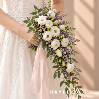 Cascading bridal bouquet with white lisianthus and purple caspia