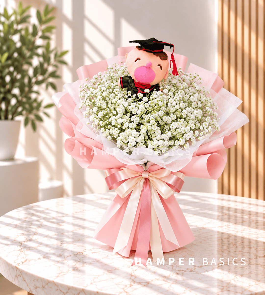 Graduation flower bouquet with white baby's breath, bear plushie in prink wrapping