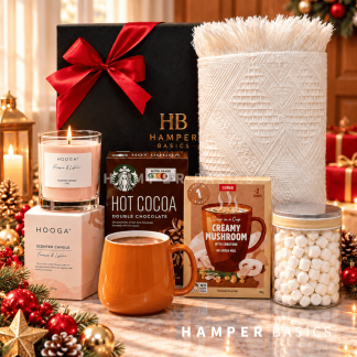 Cosy Christmas hamper with a soft Nordic throw, scented candle, comforting hot cocoa, a stylish mug and sweet marshmallows