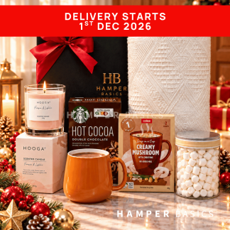 Cosy Christmas hamper with a soft Nordic throw, scented candle, comforting hot cocoa, a stylish mug and sweet marshmallows